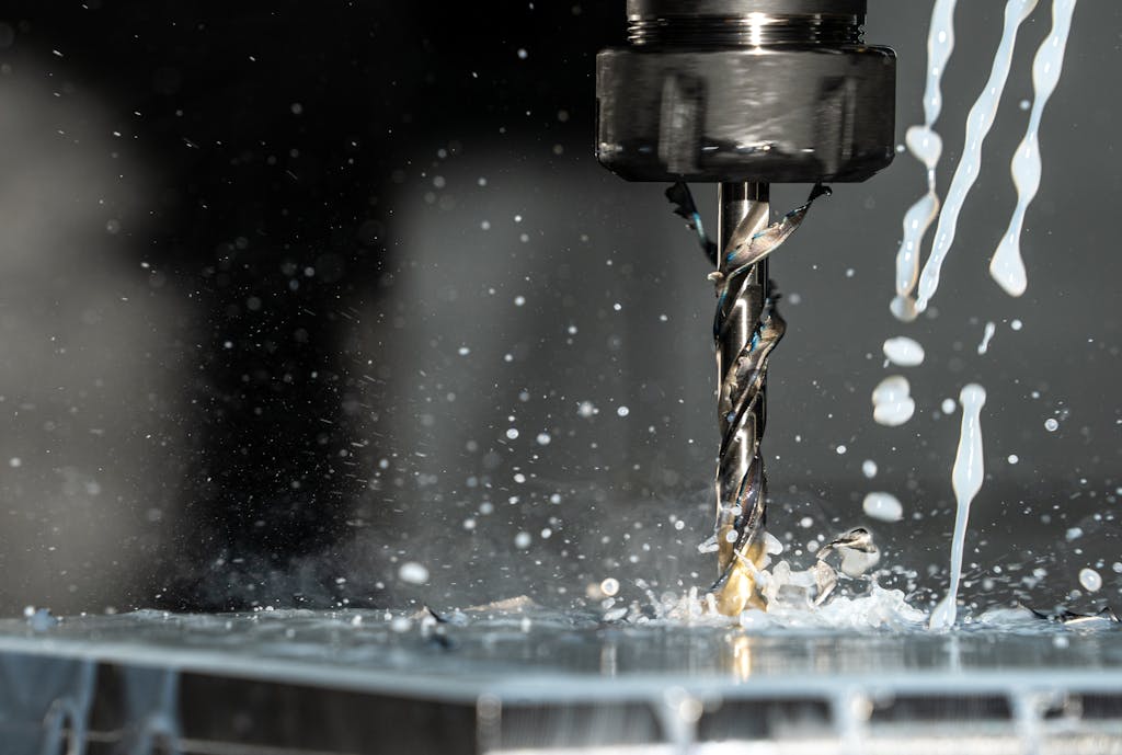 Close Up Phot of a CNC Milling Machine with Metalworking Fluid